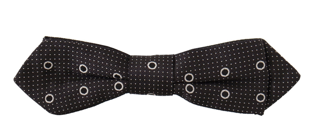 Cravate papillon en soie 100% avec pois blancs sur fond noir.
