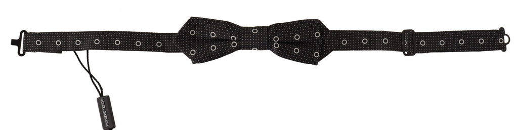 Cravate papillon en soie 100% avec pois blancs sur fond noir.