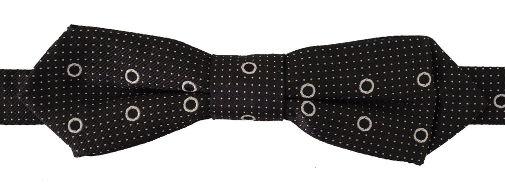 Cravate papillon en soie 100% avec pois blancs sur fond noir.