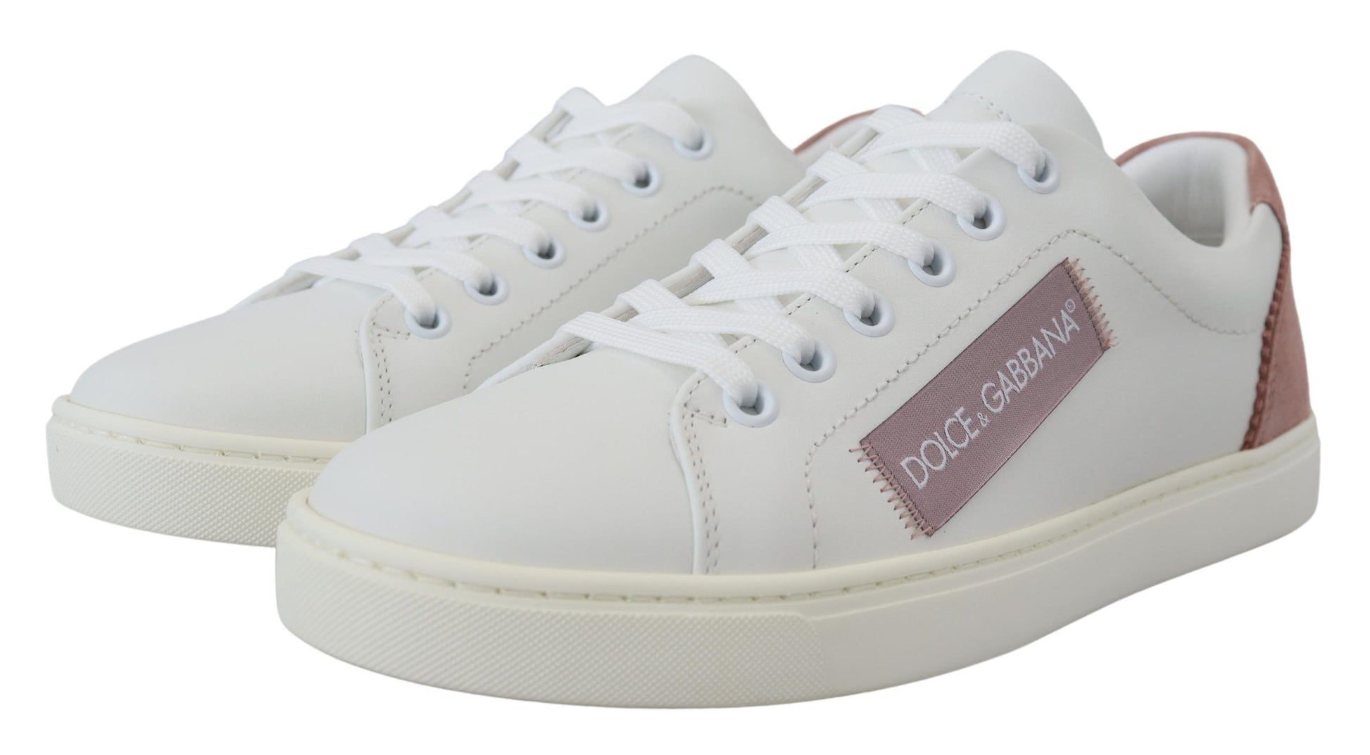 Sneakers basses en cuir blanc et rose.