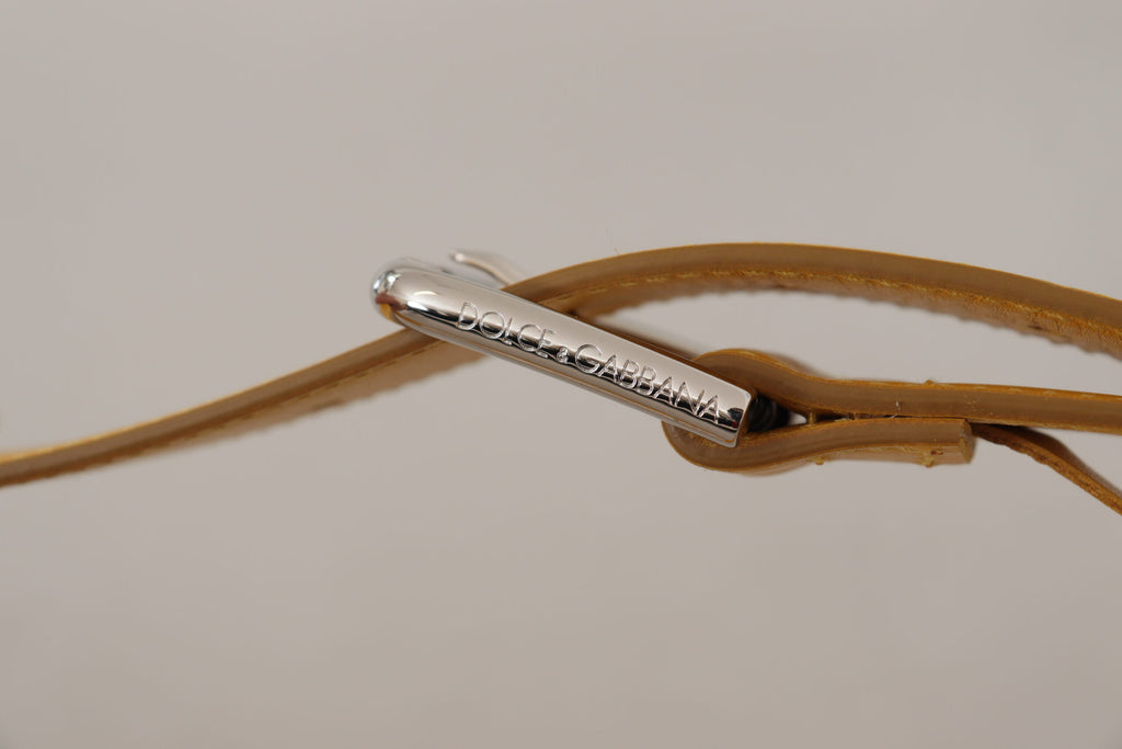 Ceinture en cuir jaune avec boucle en métal argenté et logo.