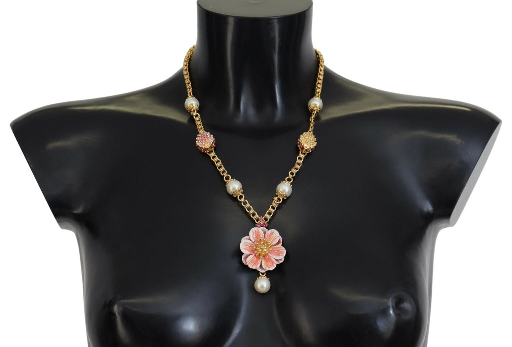 Collier doré à motifs floraux, ornements roses et cristaux.