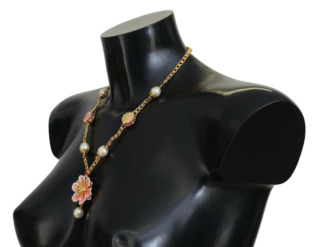 Collier doré à motifs floraux, ornements roses et cristaux.