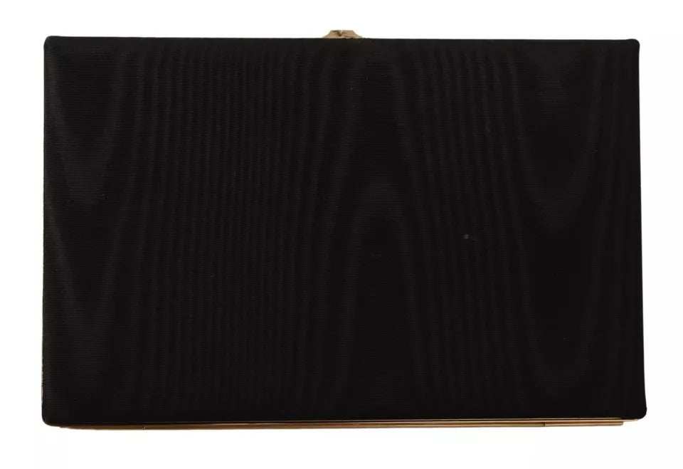 Sac à main de soirée, pochette en soie noire avec cadre doré.