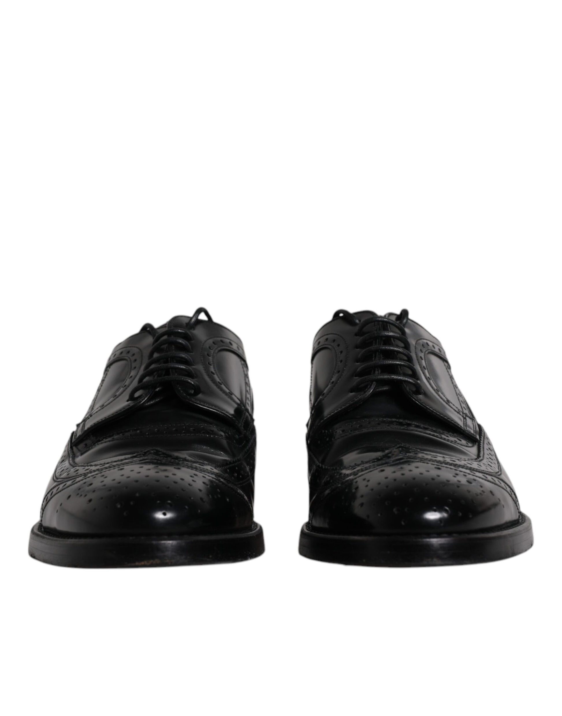 Chaussures habillées en cuir noir, style derby à bout pointu.