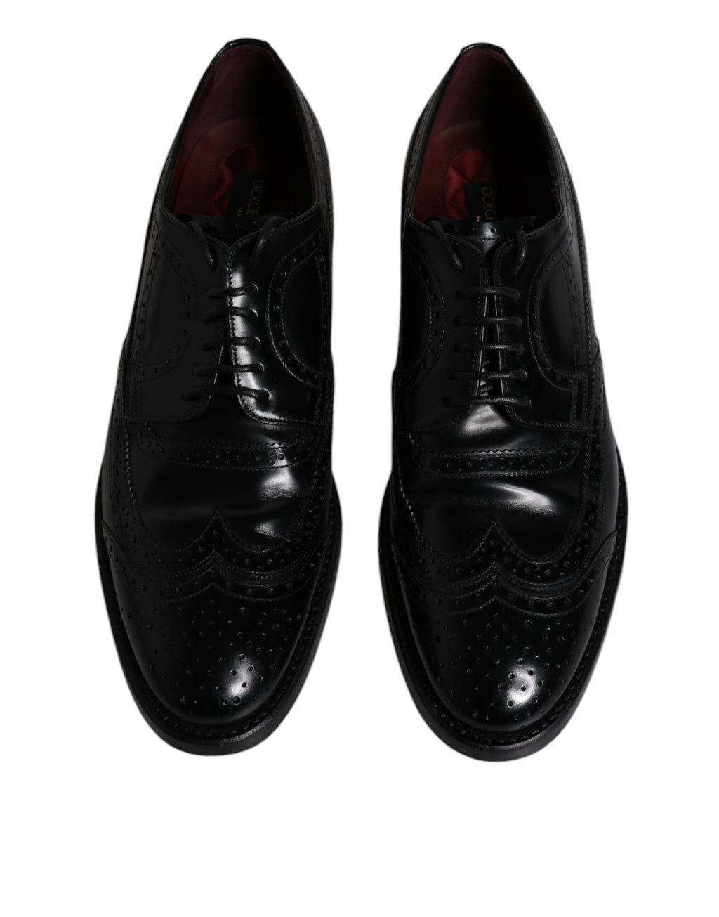 Chaussures habillées en cuir noir, style derby à bout pointu.