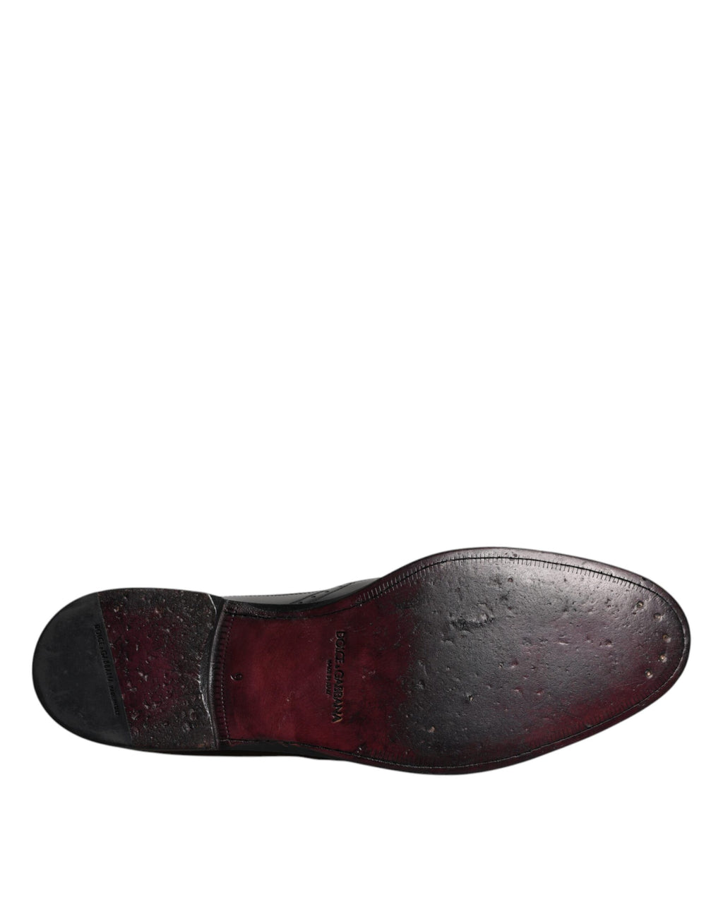 Chaussures habillées en cuir noir, style derby à bout pointu.