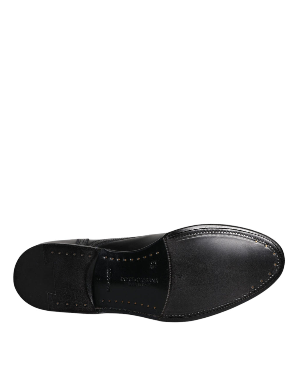 Chaussures habillées en cuir noir, style derby à bout pointu.