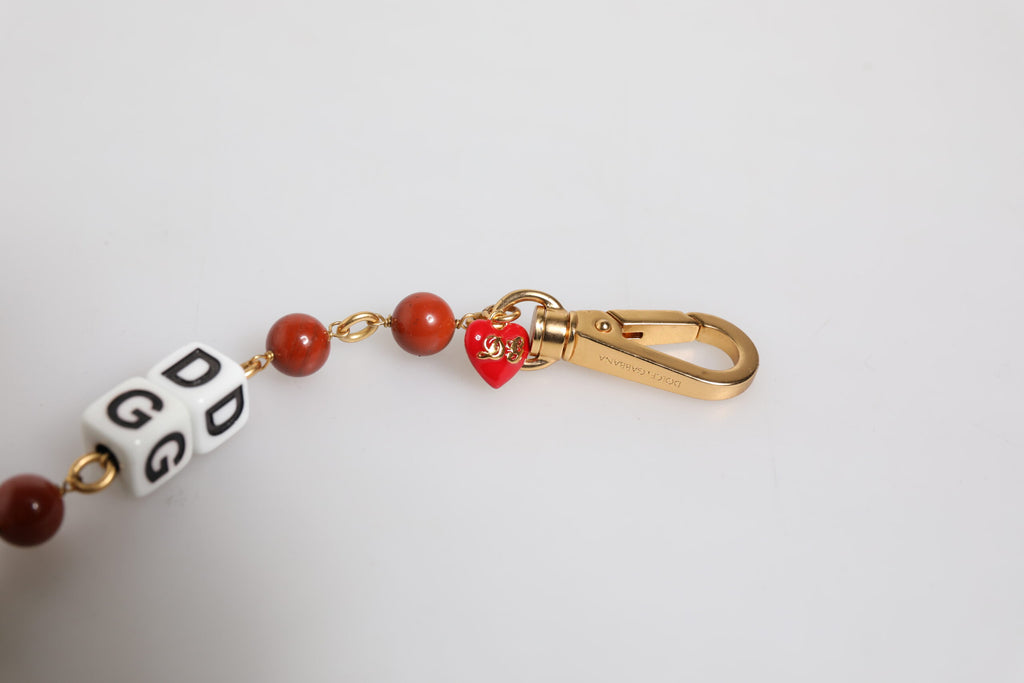 Bracelet en chaîne en laiton doré multicolore avec logo DG et dés.