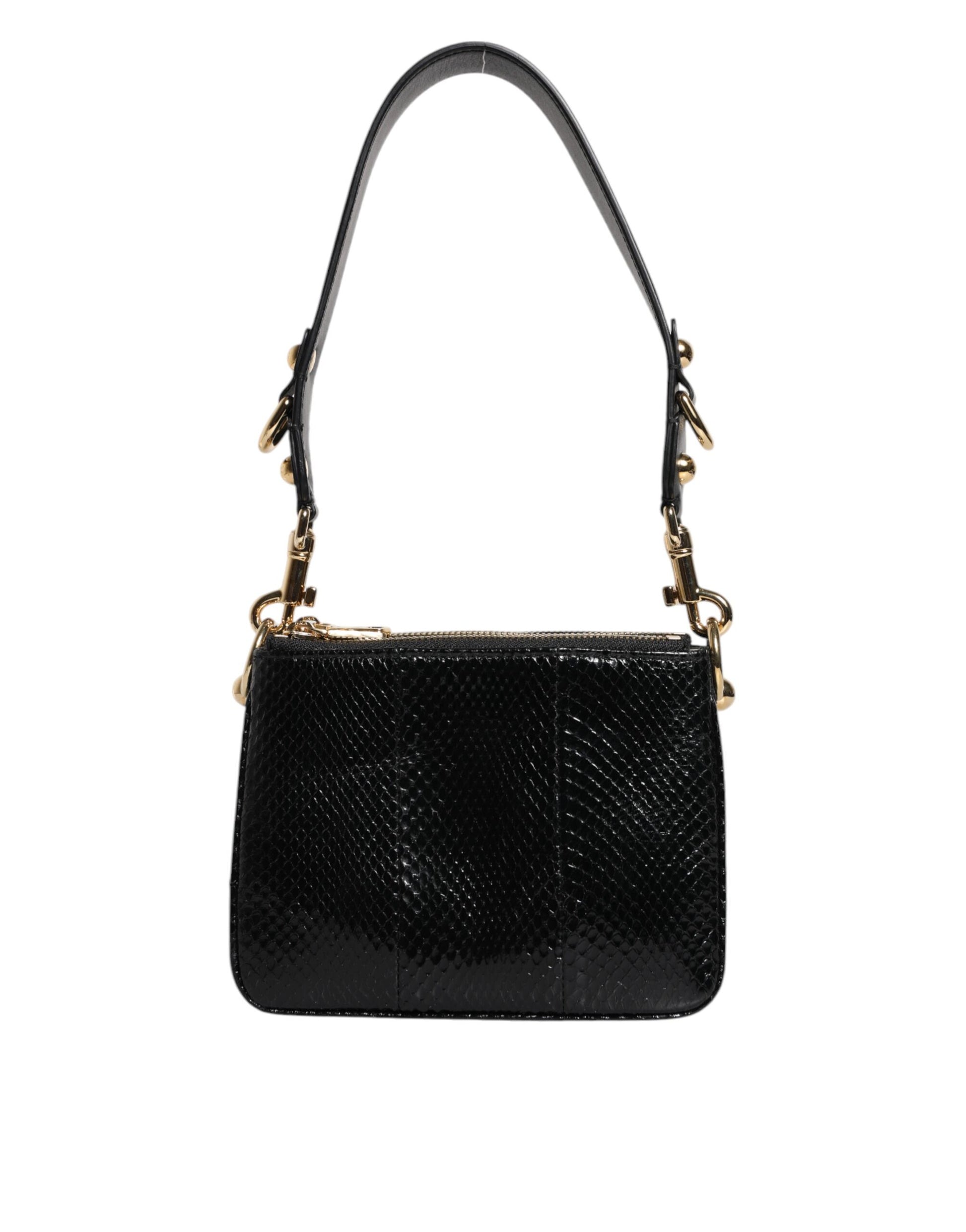 Sac à main porté épaule ou porté à la main en cuir exotique noir.