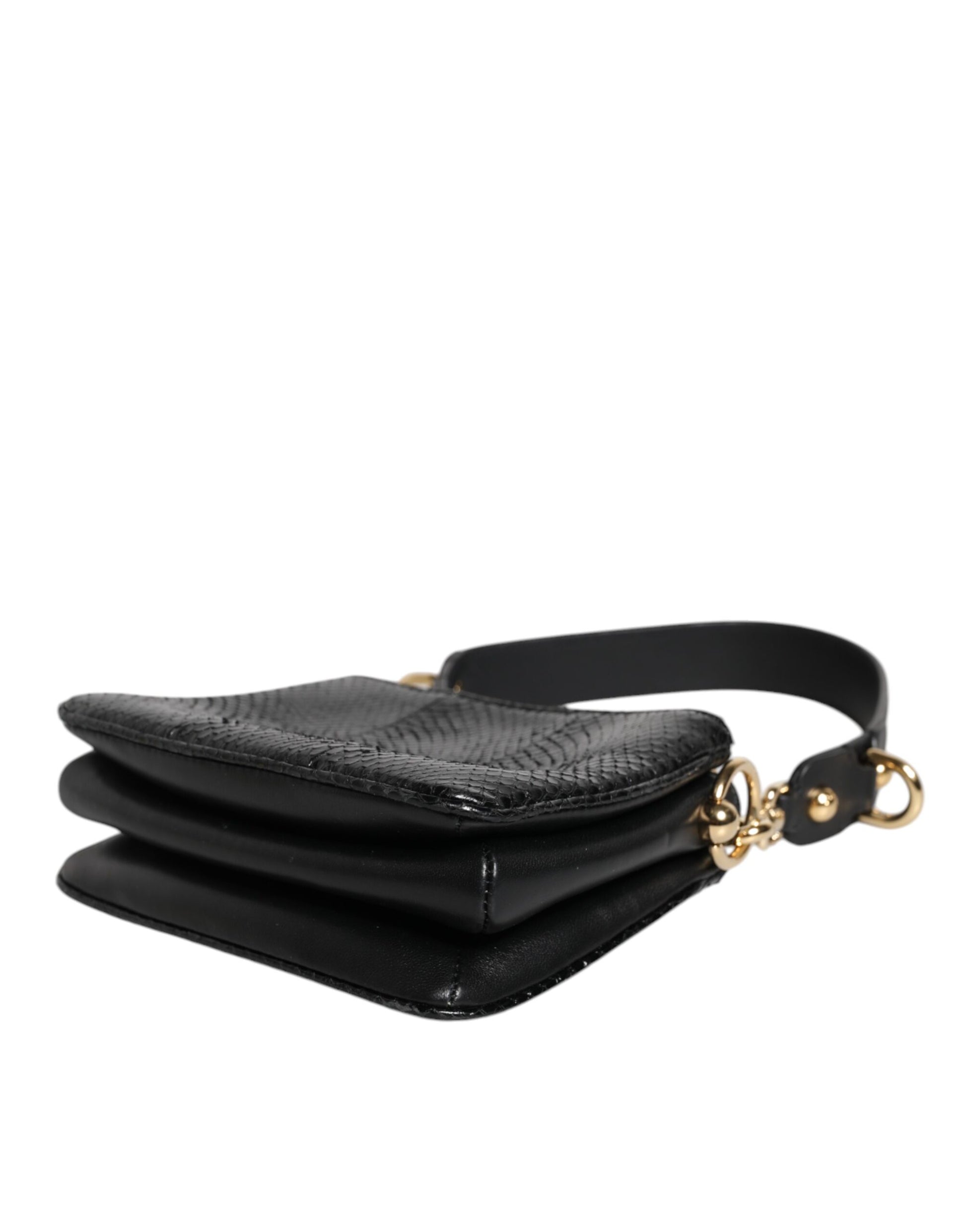 Sac à main porté épaule ou porté à la main en cuir exotique noir.
