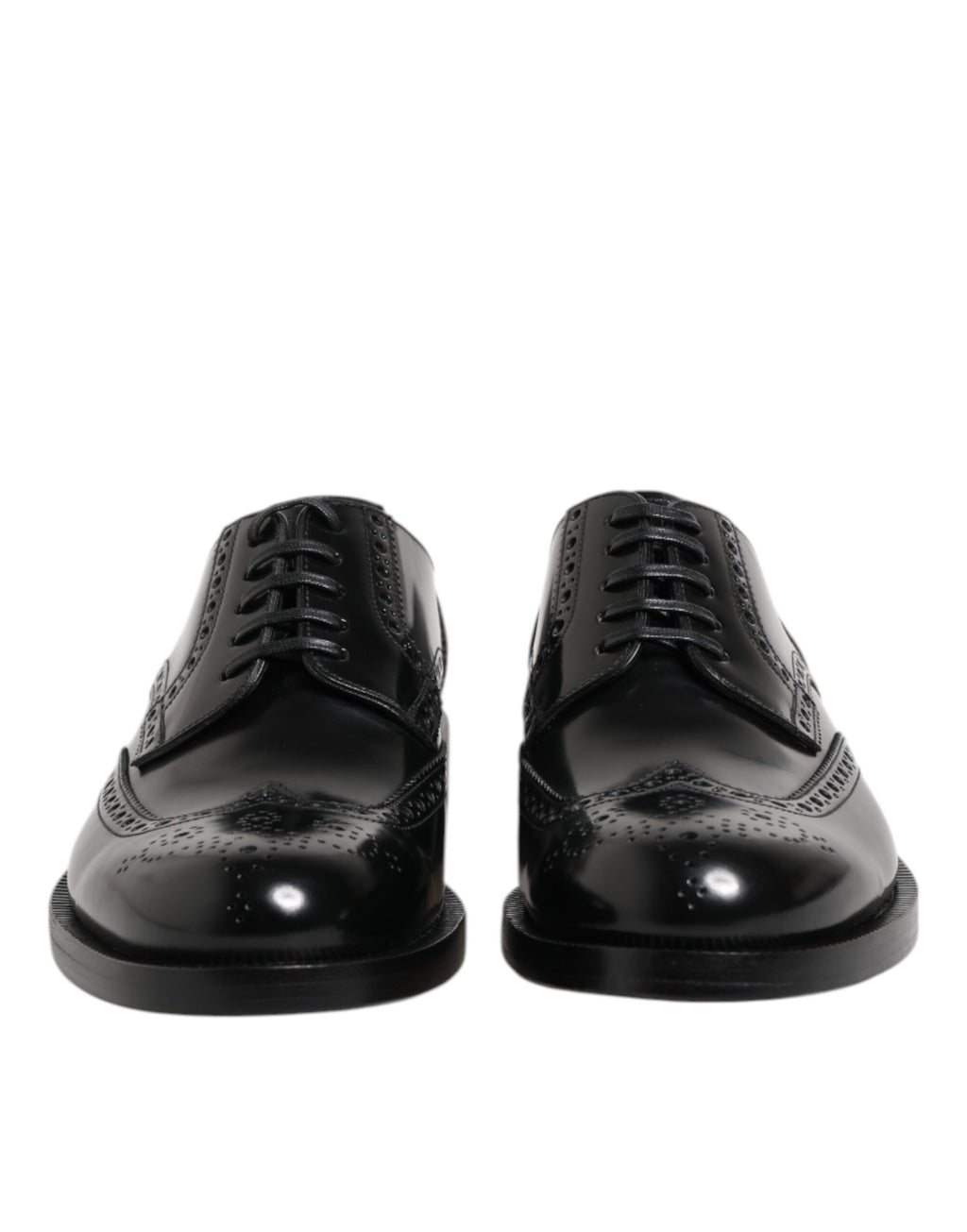 Chaussures habillées en cuir noir, style derby à bout pointu.