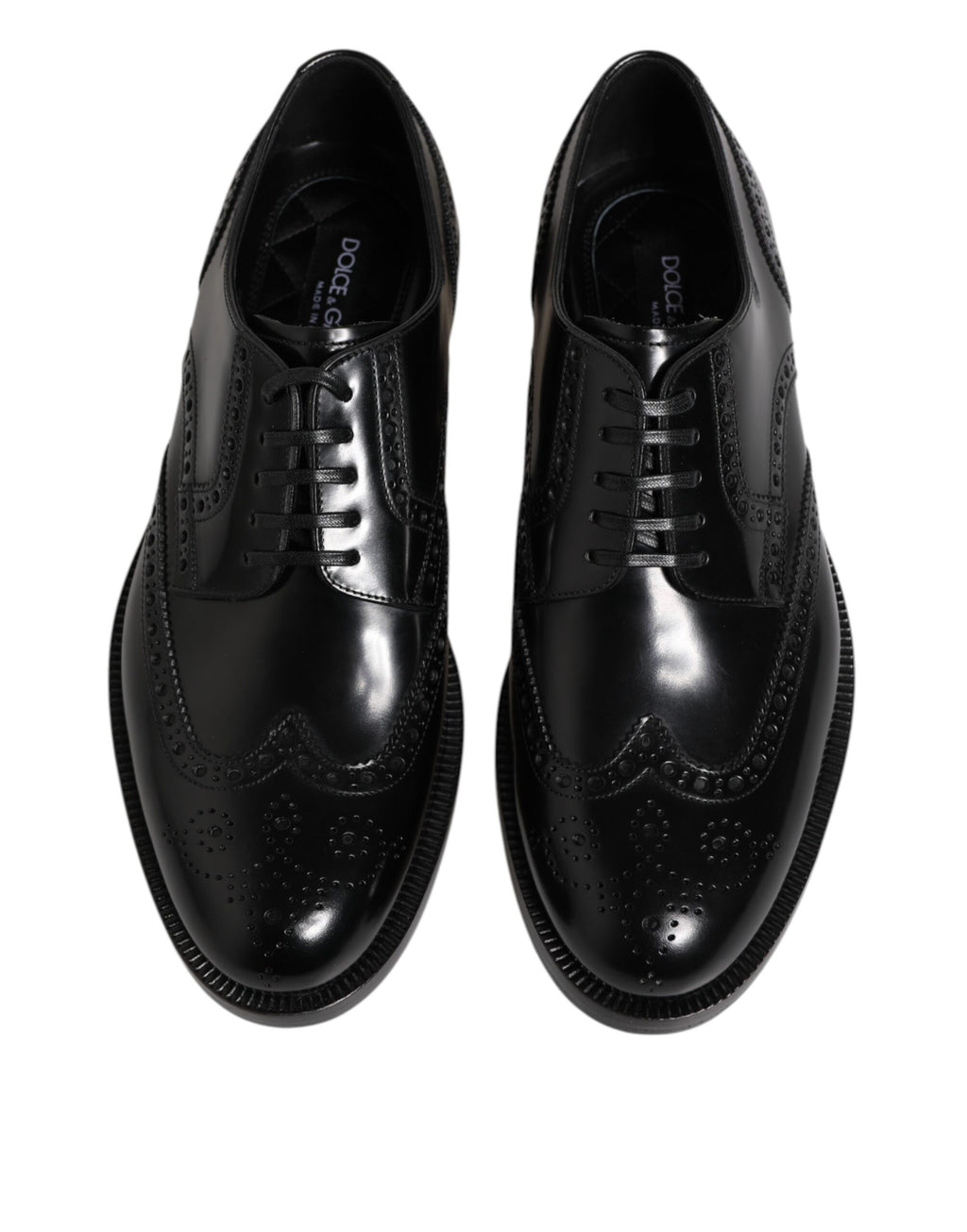 Chaussures habillées en cuir noir, style derby à bout pointu.